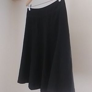Knee length black skirt